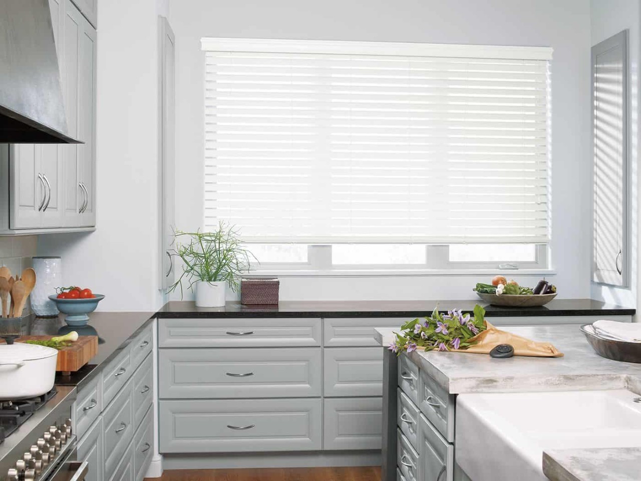 Image of EverWood® Faux Wood Blinds on a window with snow outside